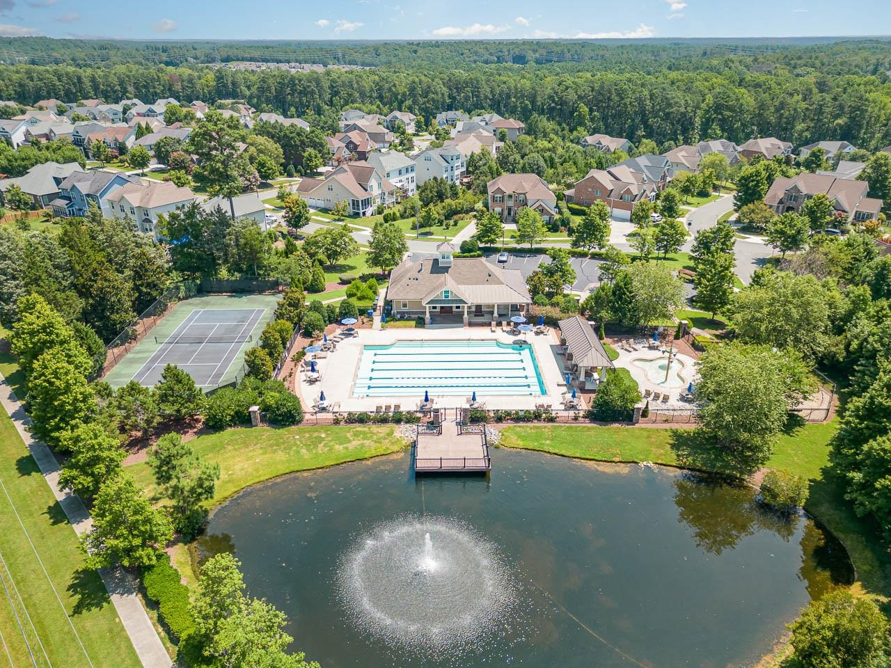 610 Swift Creek Crossing Durham, NC 27713 - Photo 48 of 48 an aerial view of a house with a garden and lake view