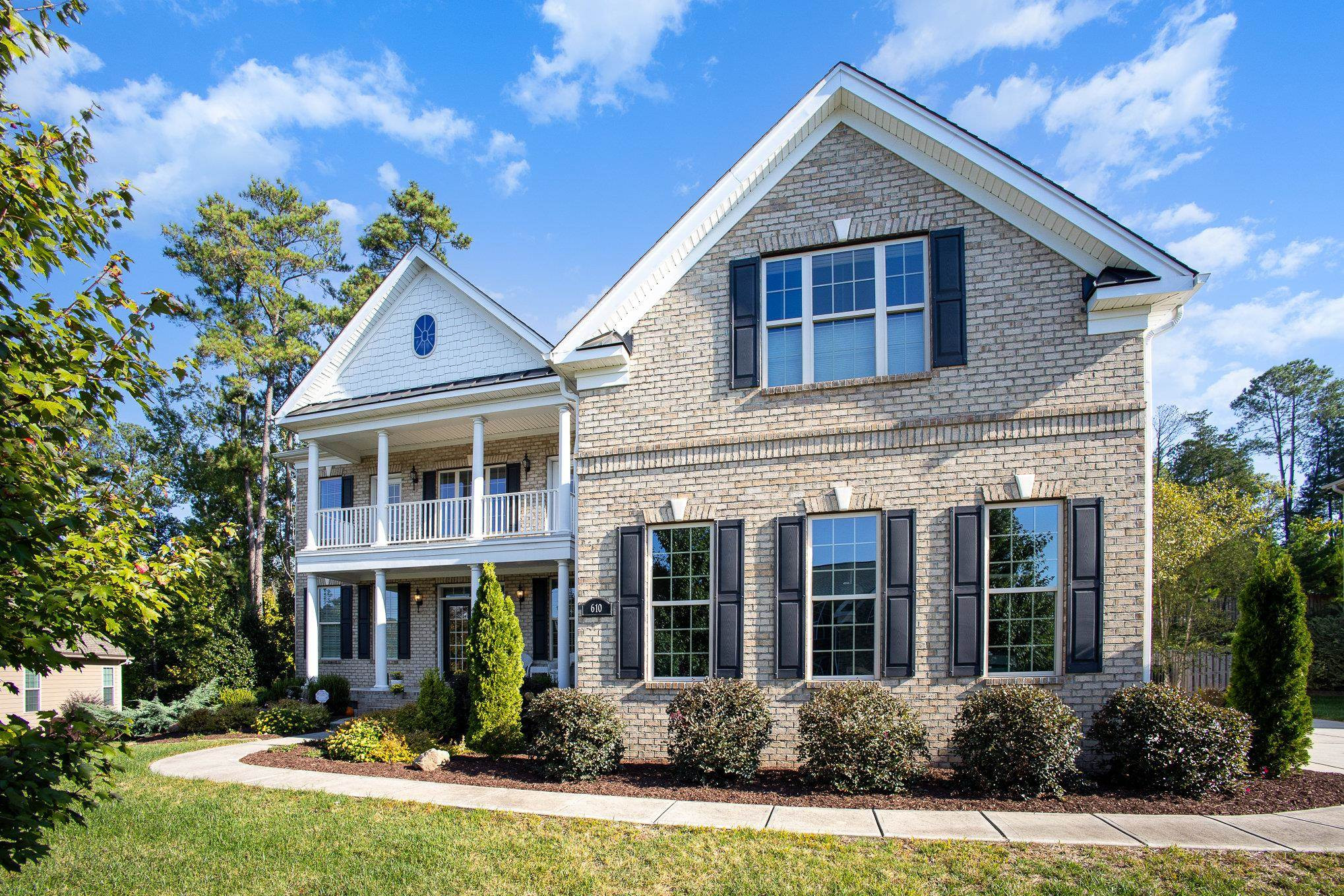 610 Swift Creek Crossing Durham, NC 27713 - Photo 5 of 48 front view of residential houses with a yard