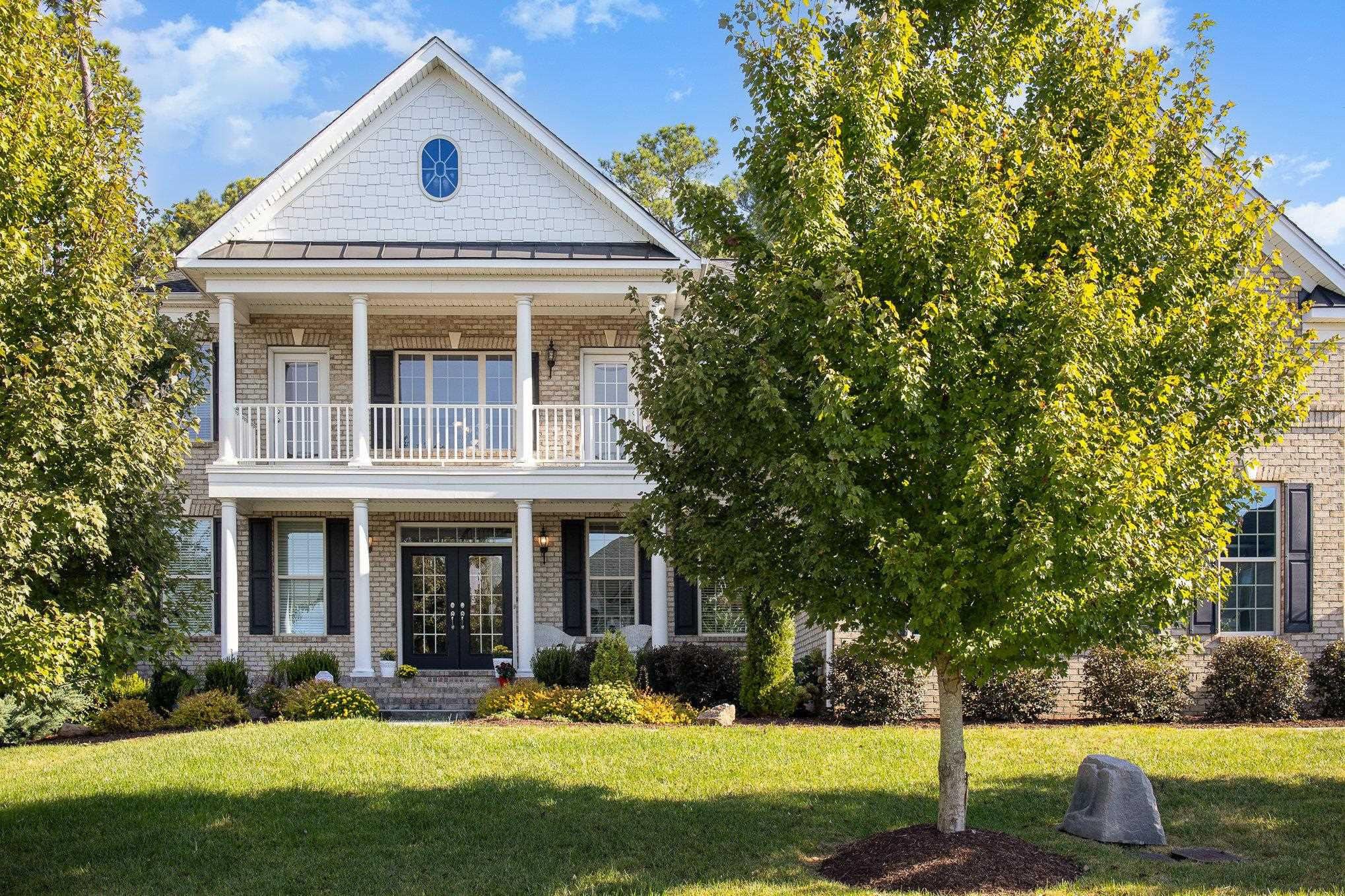 610 Swift Creek Crossing Durham, NC 27713 - Photo 6 of 48 a front view of a house with a yard