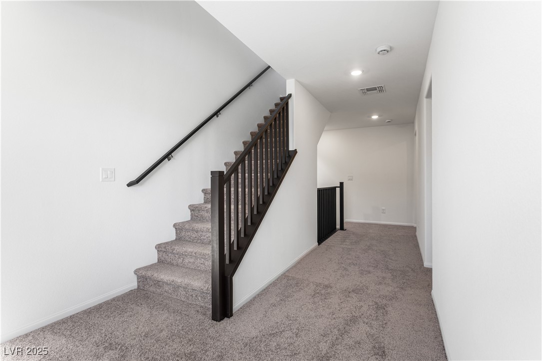 5678 Spring Trellis Street Las Vegas, NV 89113 - Photo 11 of 22 Stairs with carpet flooring and recessed lighting