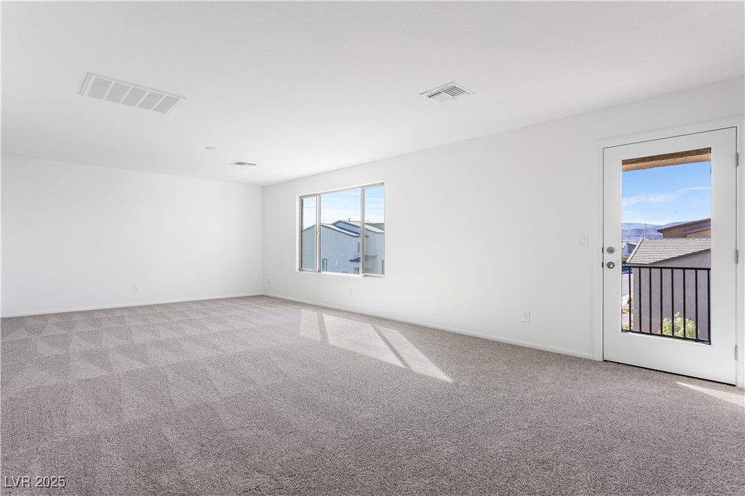 5678 Spring Trellis Street Las Vegas, NV 89113 - Photo 14 of 22 Empty room featuring light carpet