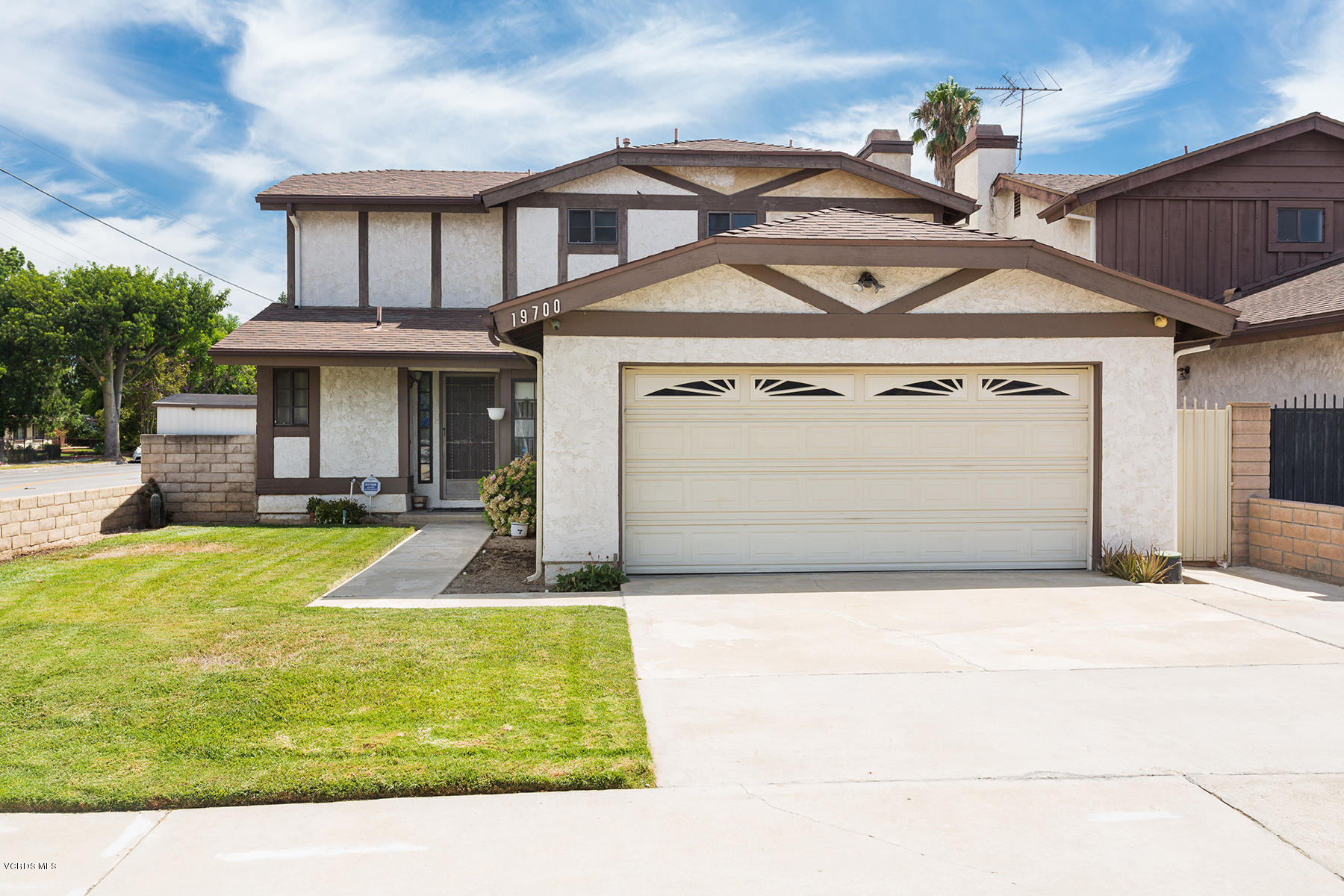 19700 Strathern Street Winnetka, CA 91306 - Photo 2 of 25 a front view of a house with a yard
