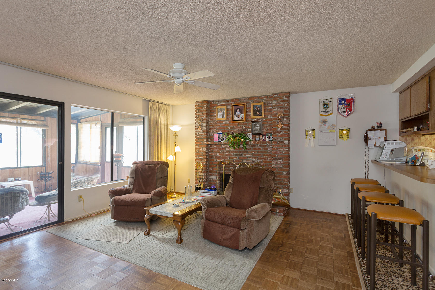 19700 Strathern Street Winnetka, CA 91306 - Photo 11 of 25 a living room with furniture and a flat screen tv