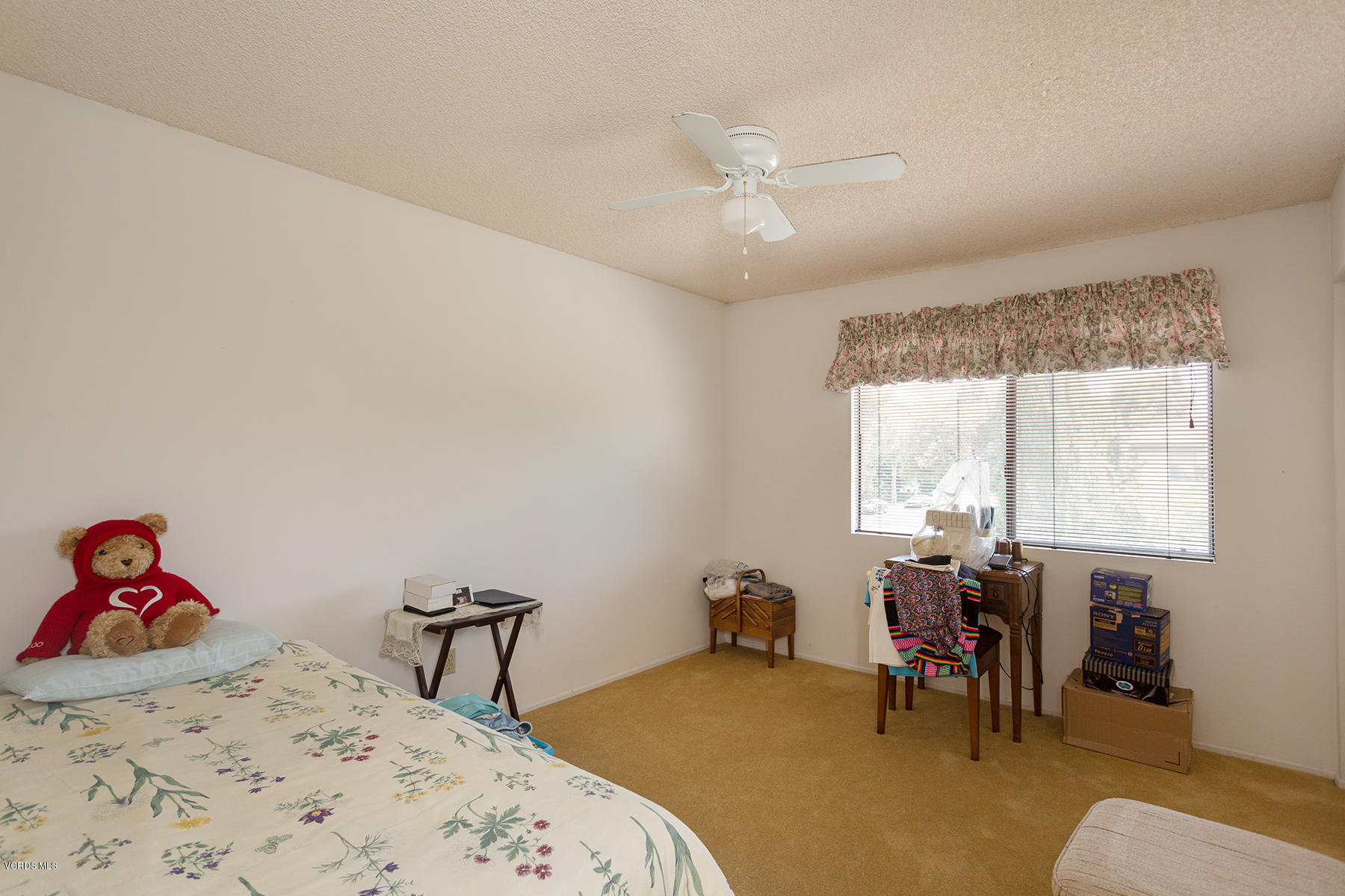 19700 Strathern Street Winnetka, CA 91306 - Photo 14 of 25 a bedroom with furniture and a window
