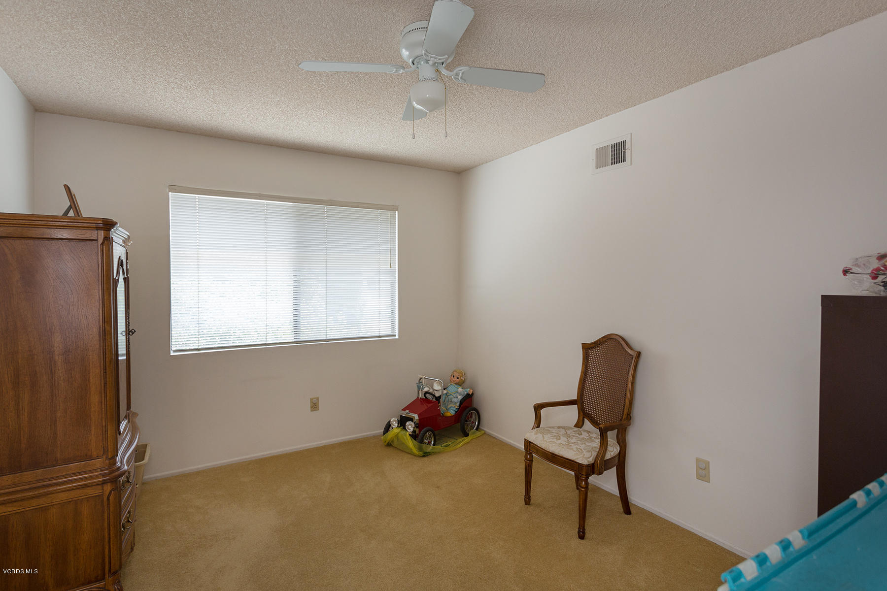 19700 Strathern Street Winnetka, CA 91306 - Photo 16 of 25 a living room with furniture and a window