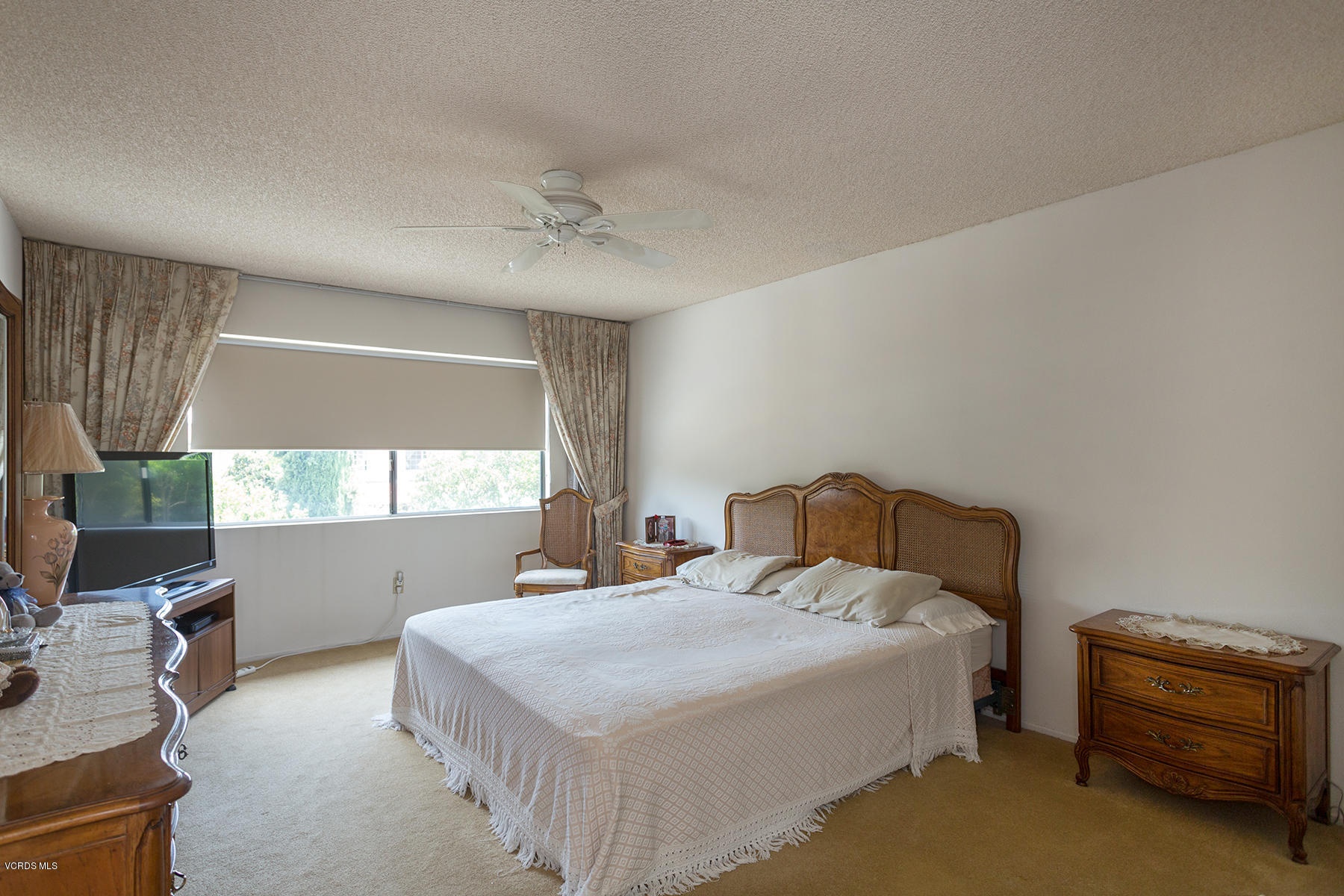 19700 Strathern Street Winnetka, CA 91306 - Photo 17 of 25 a bedroom with a bed and a window