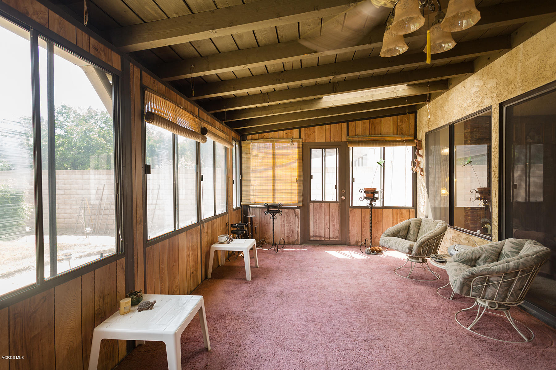 19700 Strathern Street Winnetka, CA 91306 - Photo 20 of 25 a living room with furniture and large windows