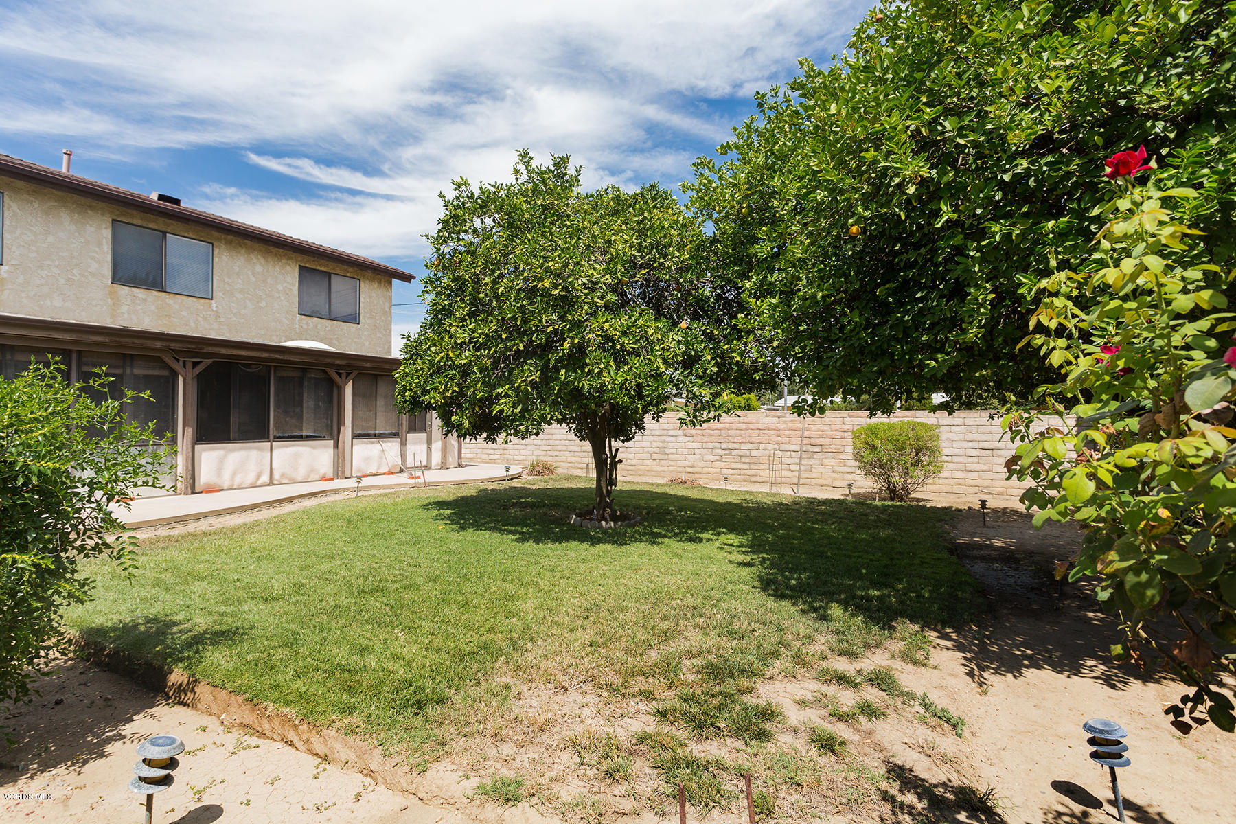 19700 Strathern Street Winnetka, CA 91306 - Photo 24 of 25 a view of backyard of house with green space