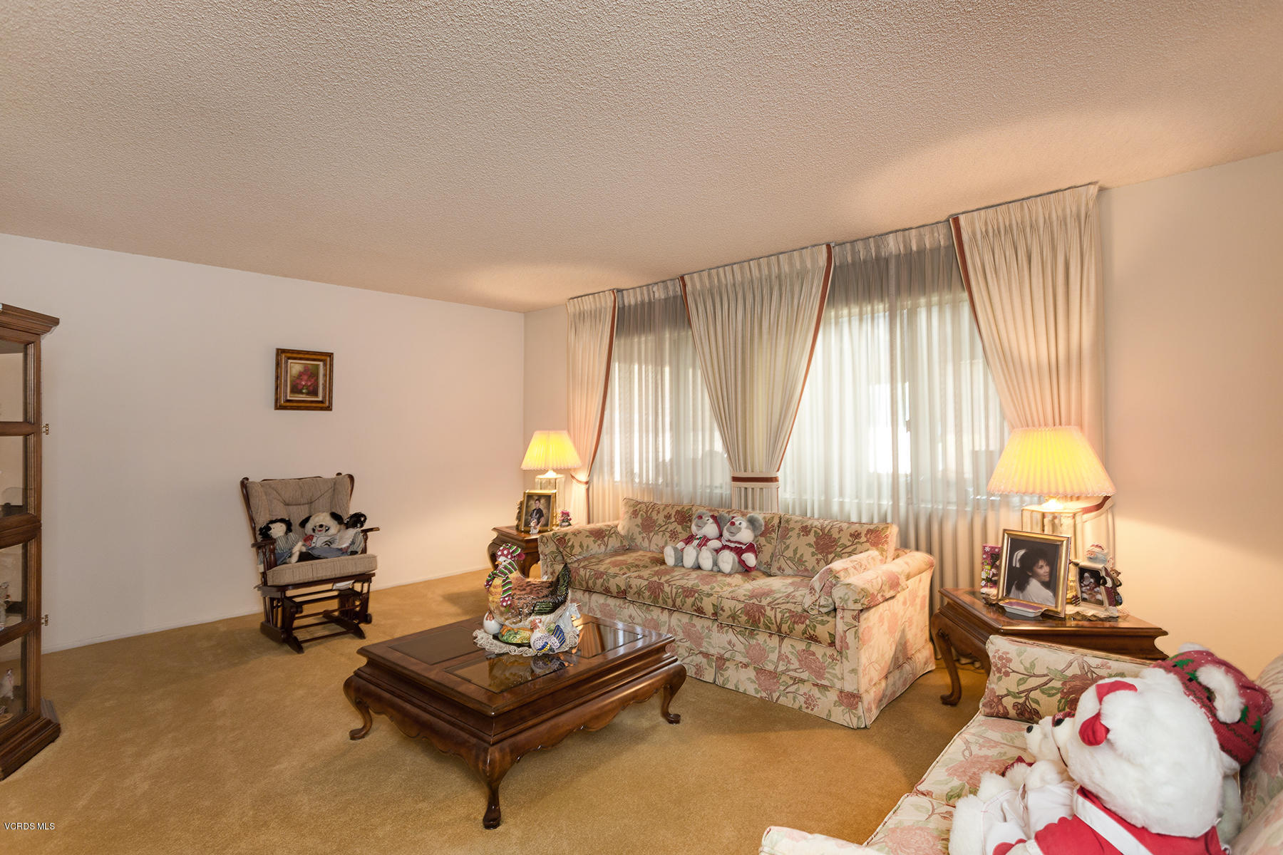 19700 Strathern Street Winnetka, CA 91306 - Photo 4 of 25 a living room with furniture and a large window
