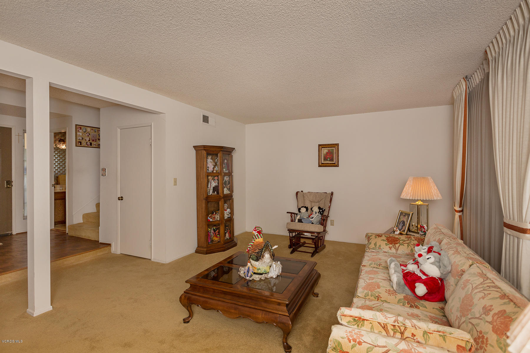 19700 Strathern Street Winnetka, CA 91306 - Photo 5 of 25 a living room with furniture and a wooden floor