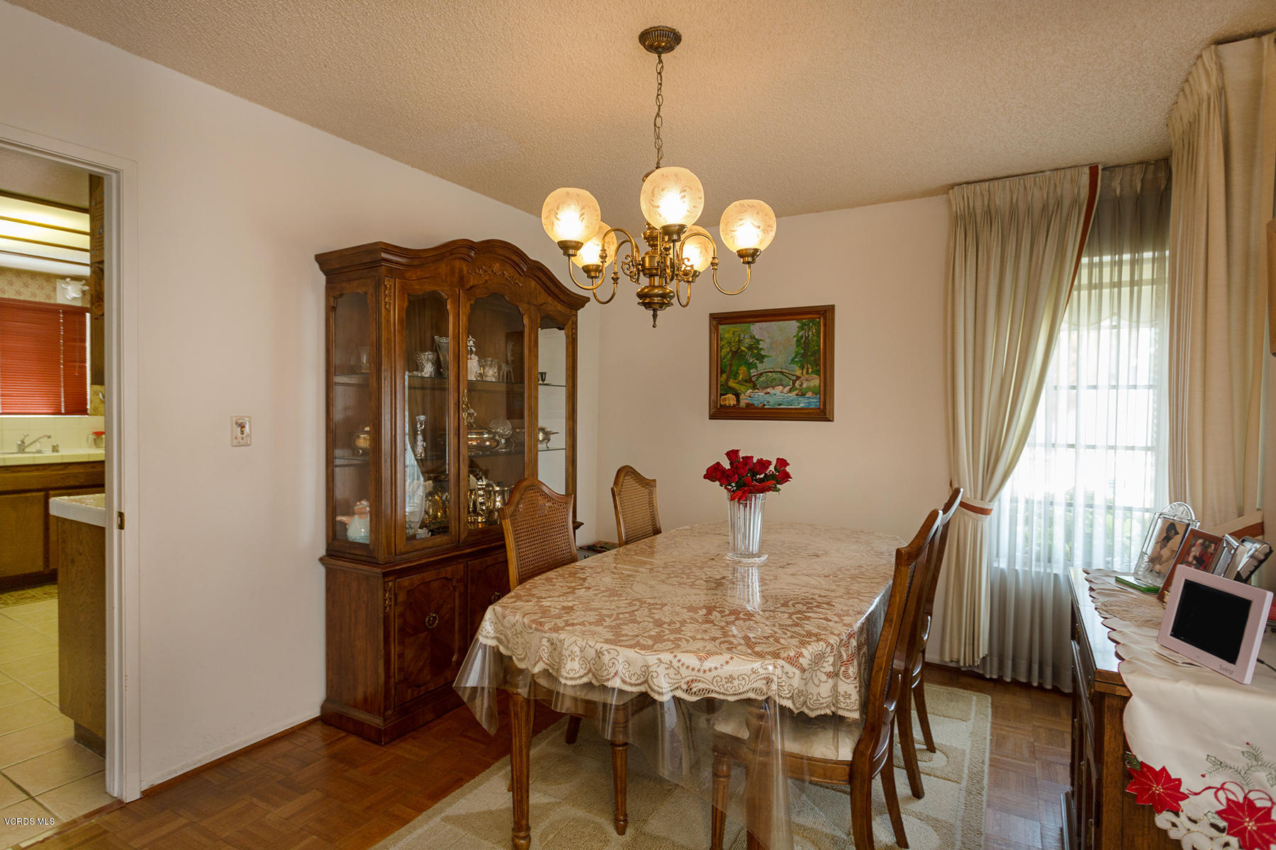 19700 Strathern Street Winnetka, CA 91306 - Photo 7 of 25 a view of a dining room with furniture and a chandelier