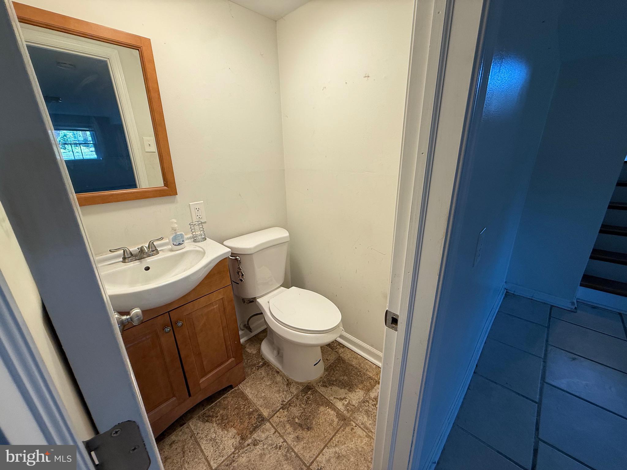 174 Kansas Road Pennsville, NJ 08070 - Photo 15 of 22 a bathroom with a sink and a mirror