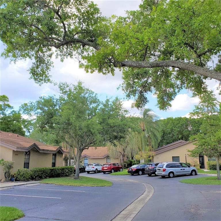 4538 Morningside, Unit 38 Sarasota, FL 34235 - Photo 2 of 13 a car parked in front of white house