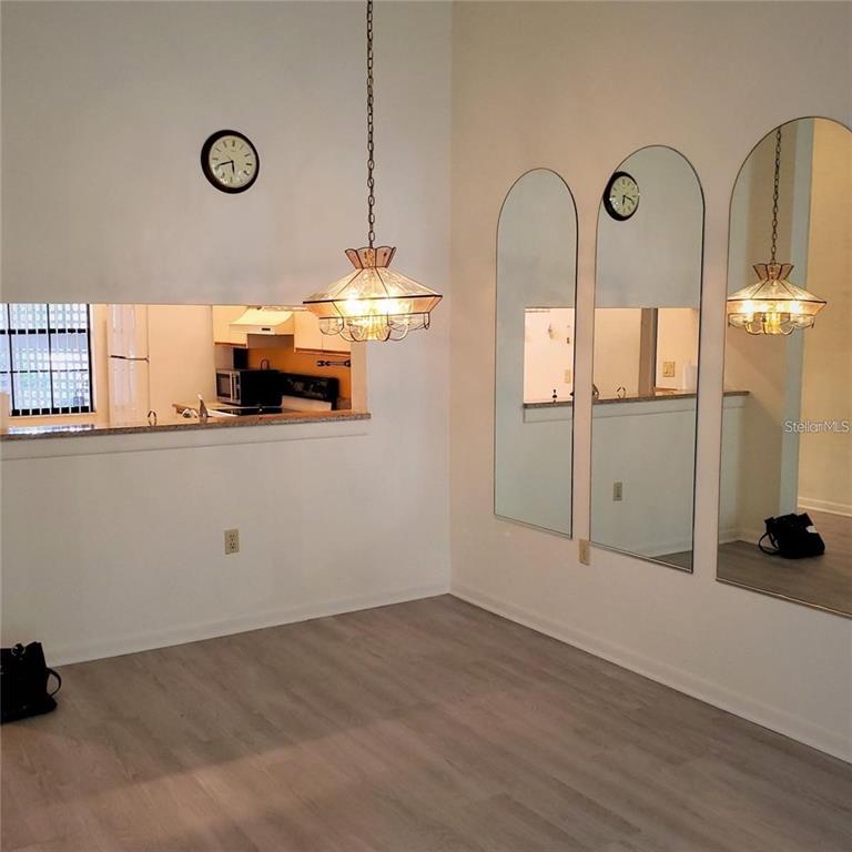 4538 Morningside, Unit 38 Sarasota, FL 34235 - Photo 5 of 13 a view of a room with wooden floor and window