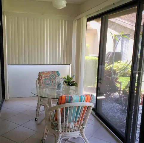 a view of a hallway with furniture and front door