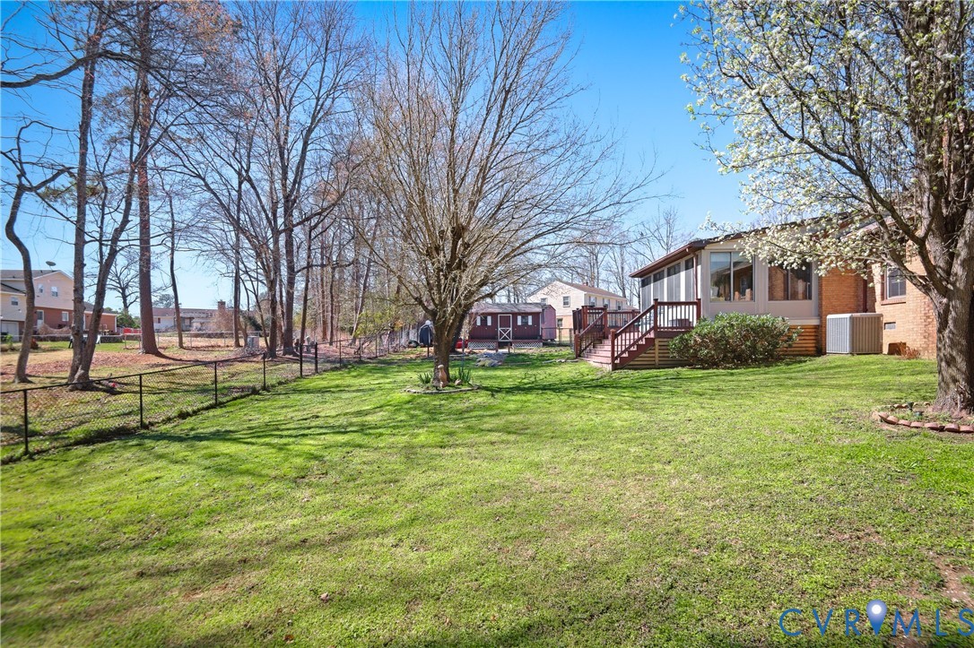 107 Oxford Road Hopewell, VA 23860 - Photo 50 of 50 Expansive grassy yard with mature trees, fenced pe