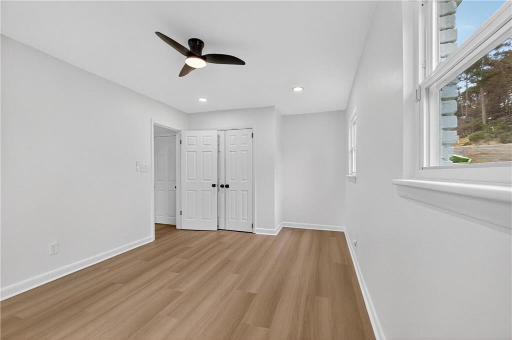 2967 Flat Shoals Road Decatur, GA 30034 - Photo 25 of 37 a view of empty room with wooden floor and fan