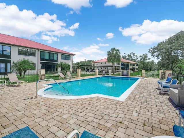a view of a swimming pool with a patio