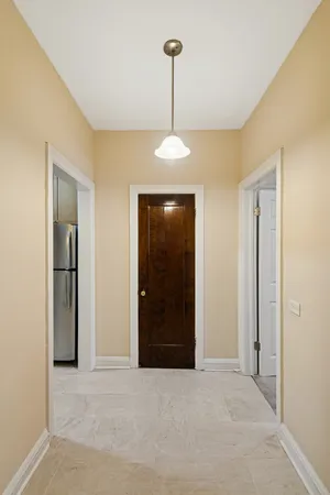 a very nice looking bedroom with a chandelier fan