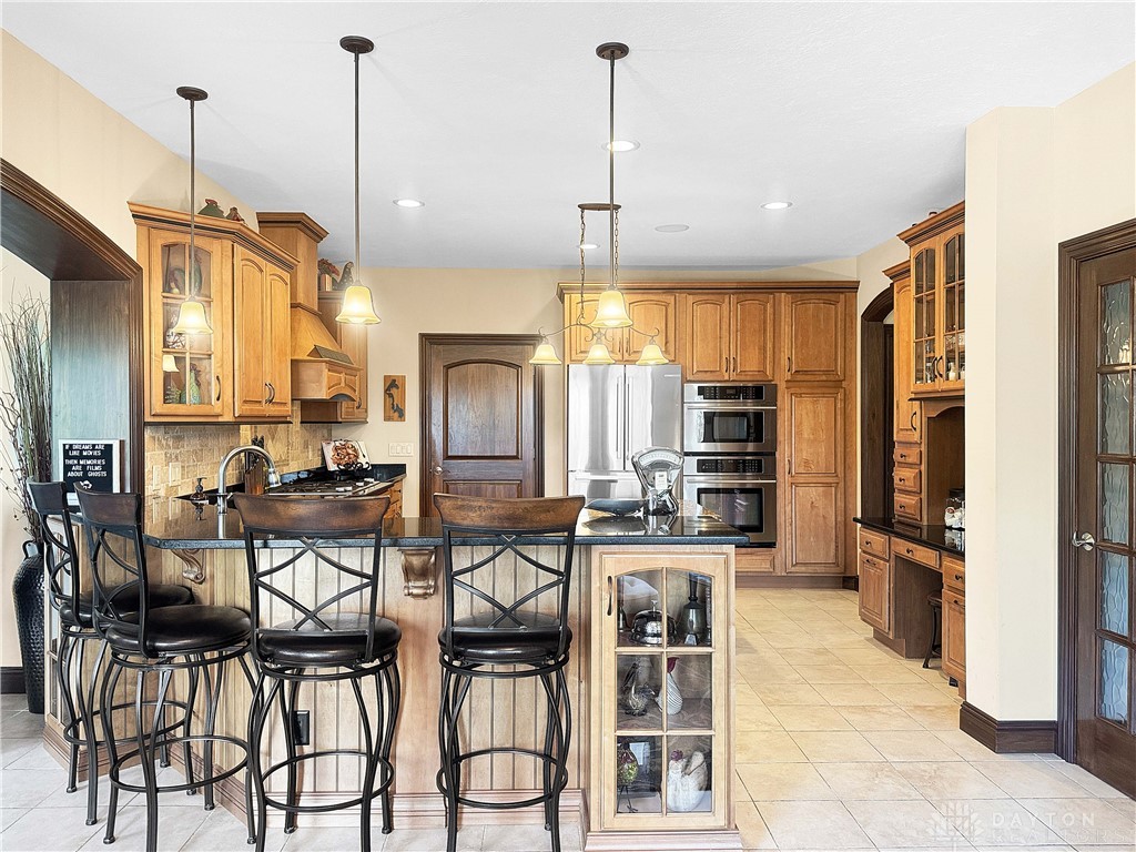 4096 Middle Urbana Road Urbana, OH 43078 - Photo 81 of 96 This spacious kitchen offers ample cabinetry, modern appliances, and a convenient breakfast bar for casual dining.
