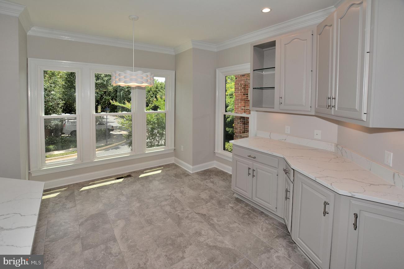 1548 Hampton Hill Circle McLean, VA 22101 - Photo 11 of 39 Quartz counters, tile floor, George Kovacs light.