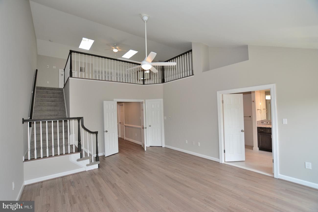 1548 Hampton Hill Circle McLean, VA 22101 - Photo 17 of 39 Stairs to loft with gas FP & bookcase