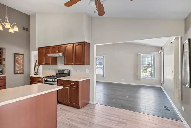 a kitchen with a stove a sink and a refrigerator
