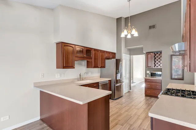 a kitchen with a sink stove and refrigerator