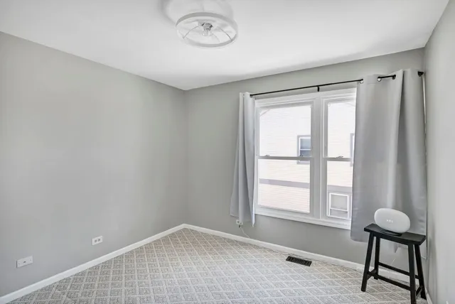 a view of an empty room and window