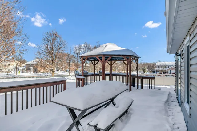 a view of a patio with furniture and a yard