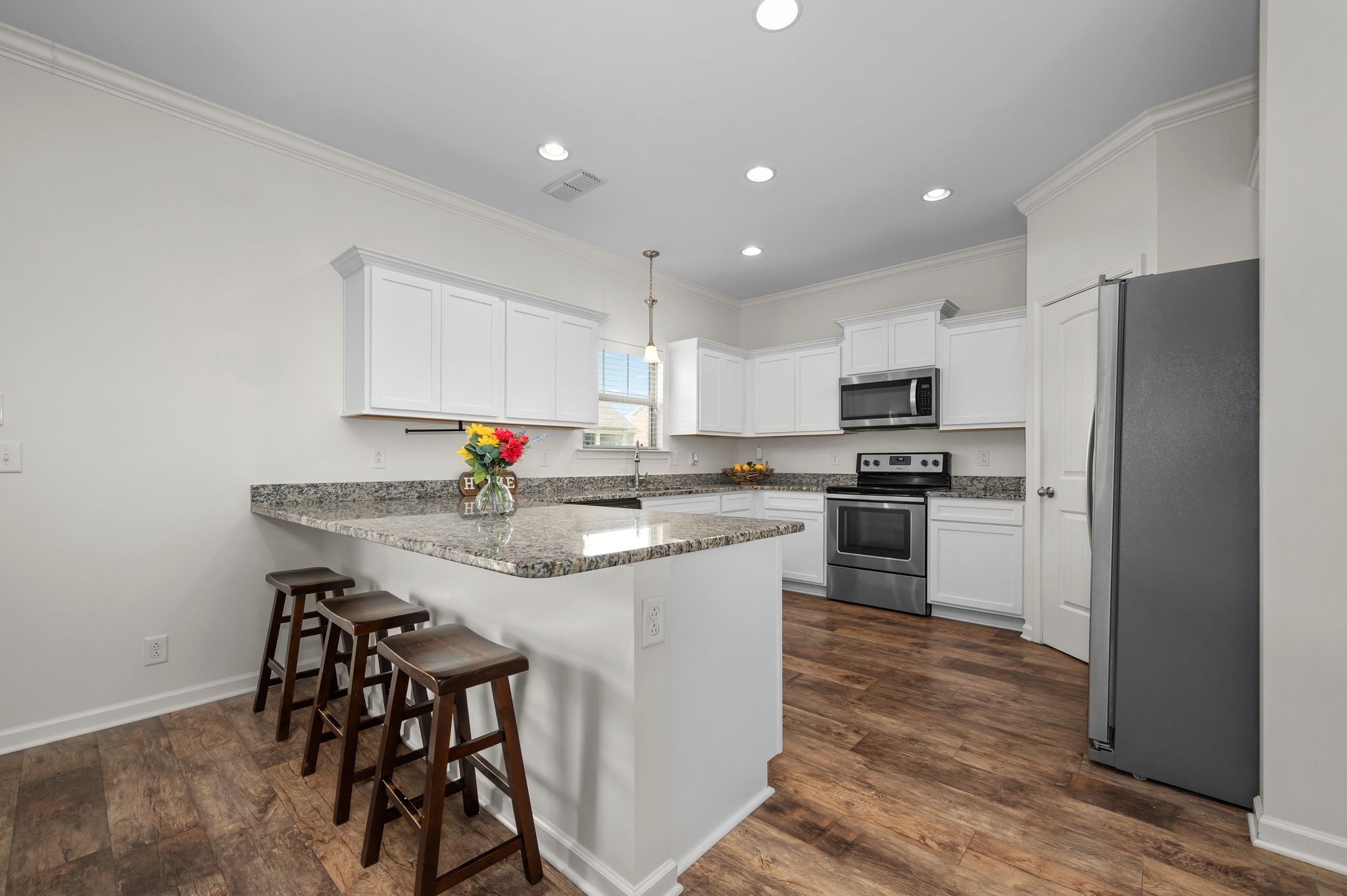 1113 Dunkirk Lane Murfreesboro, TN 37129 - Photo 12 of 31 a kitchen with white cabinets stainless steel appliances and a refrigerator