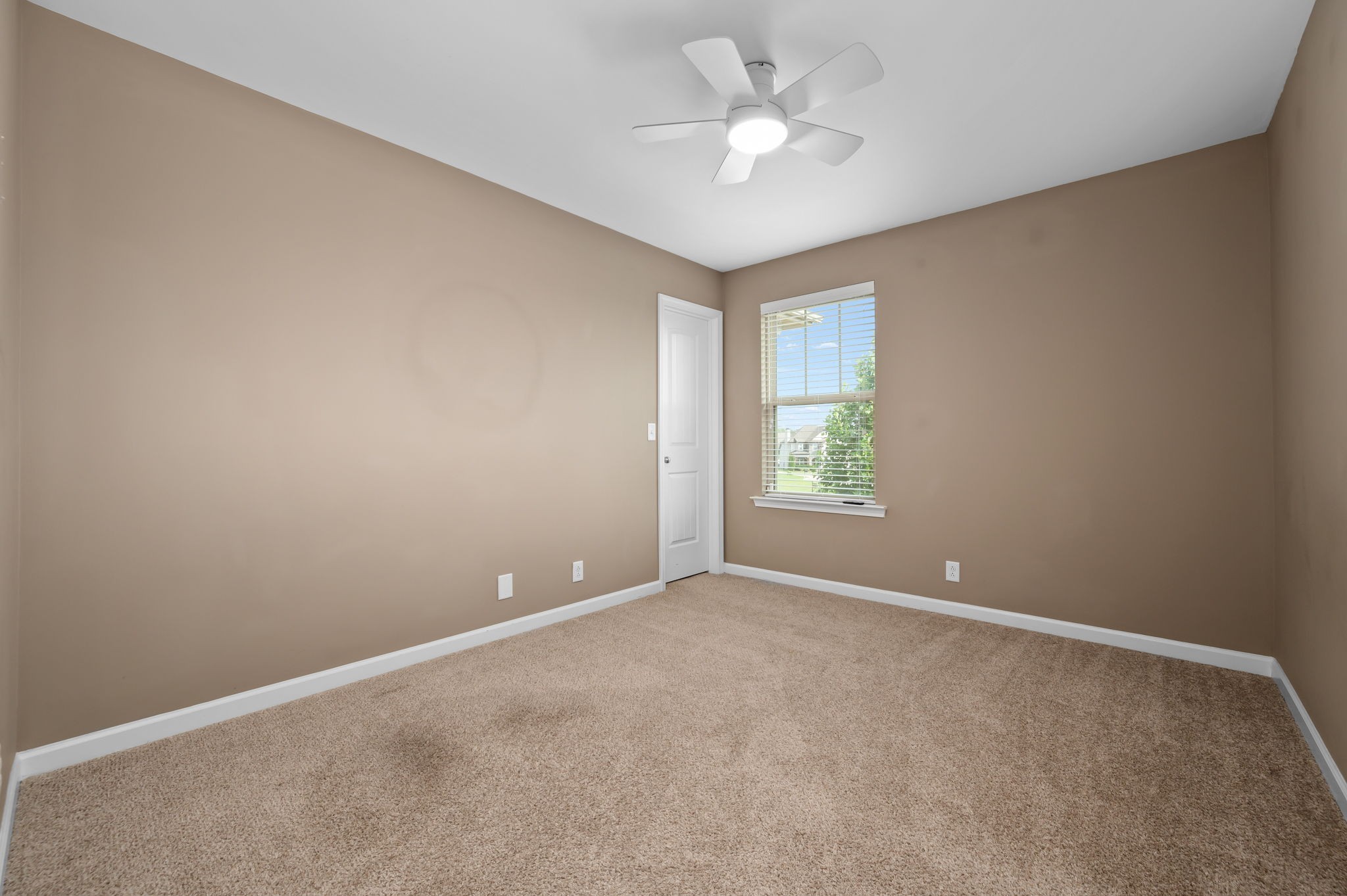 1113 Dunkirk Lane Murfreesboro, TN 37129 - Photo 16 of 31 an empty room with windows and fan