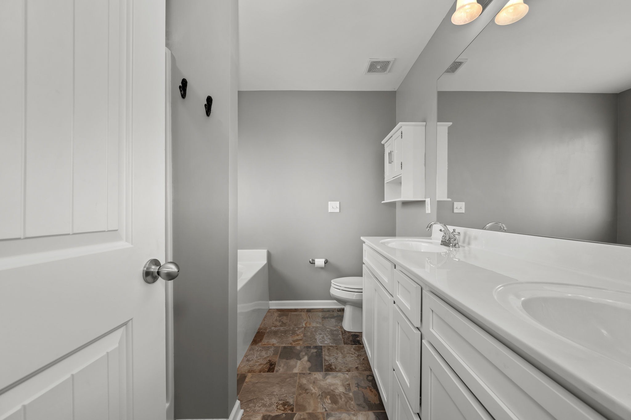1113 Dunkirk Lane Murfreesboro, TN 37129 - Photo 19 of 31 a bathroom with a sink a toilet and vanity