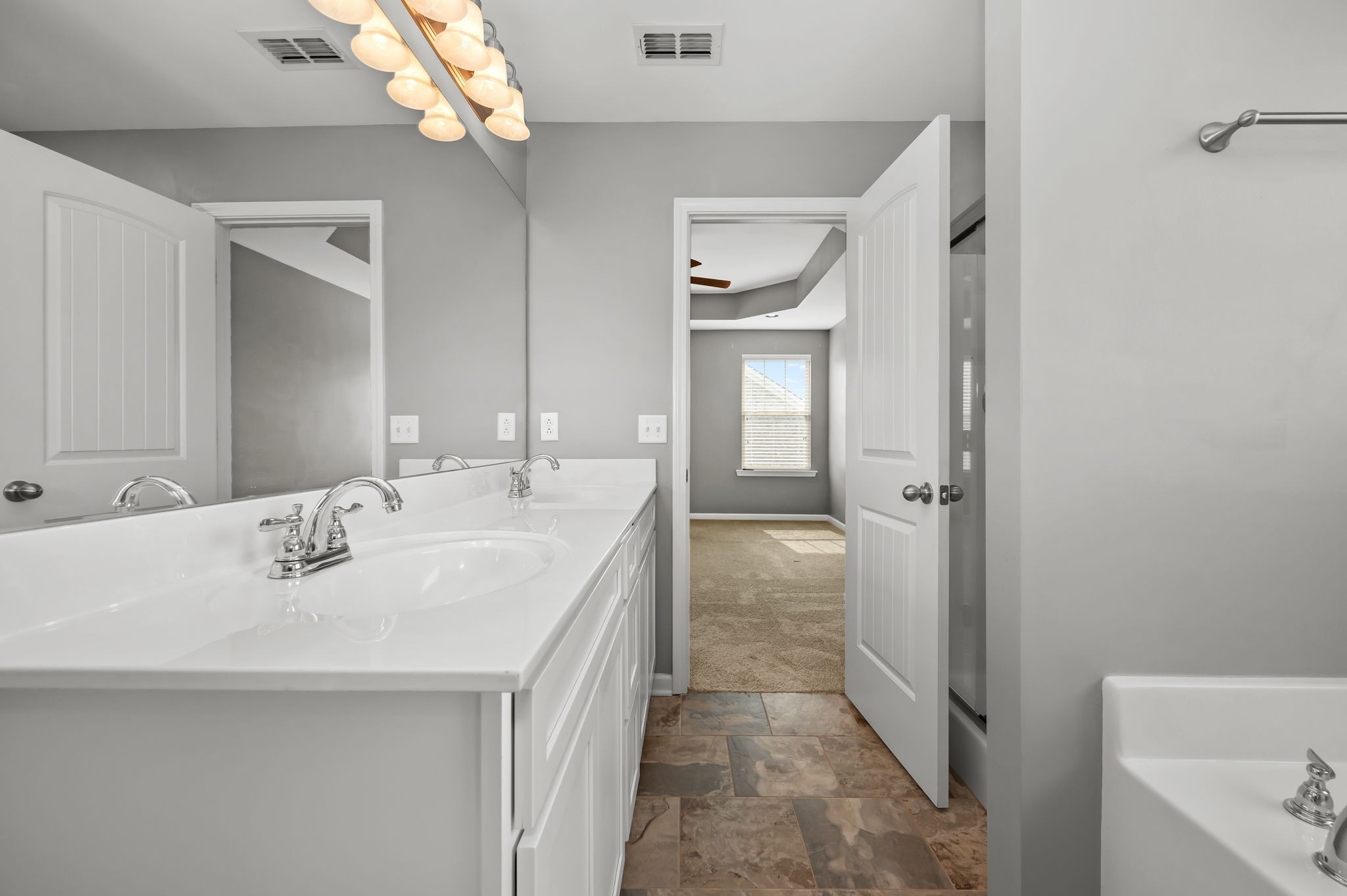 1113 Dunkirk Lane Murfreesboro, TN 37129 - Photo 21 of 31 a en suite bathroom with a sink a mirror and a bathtub