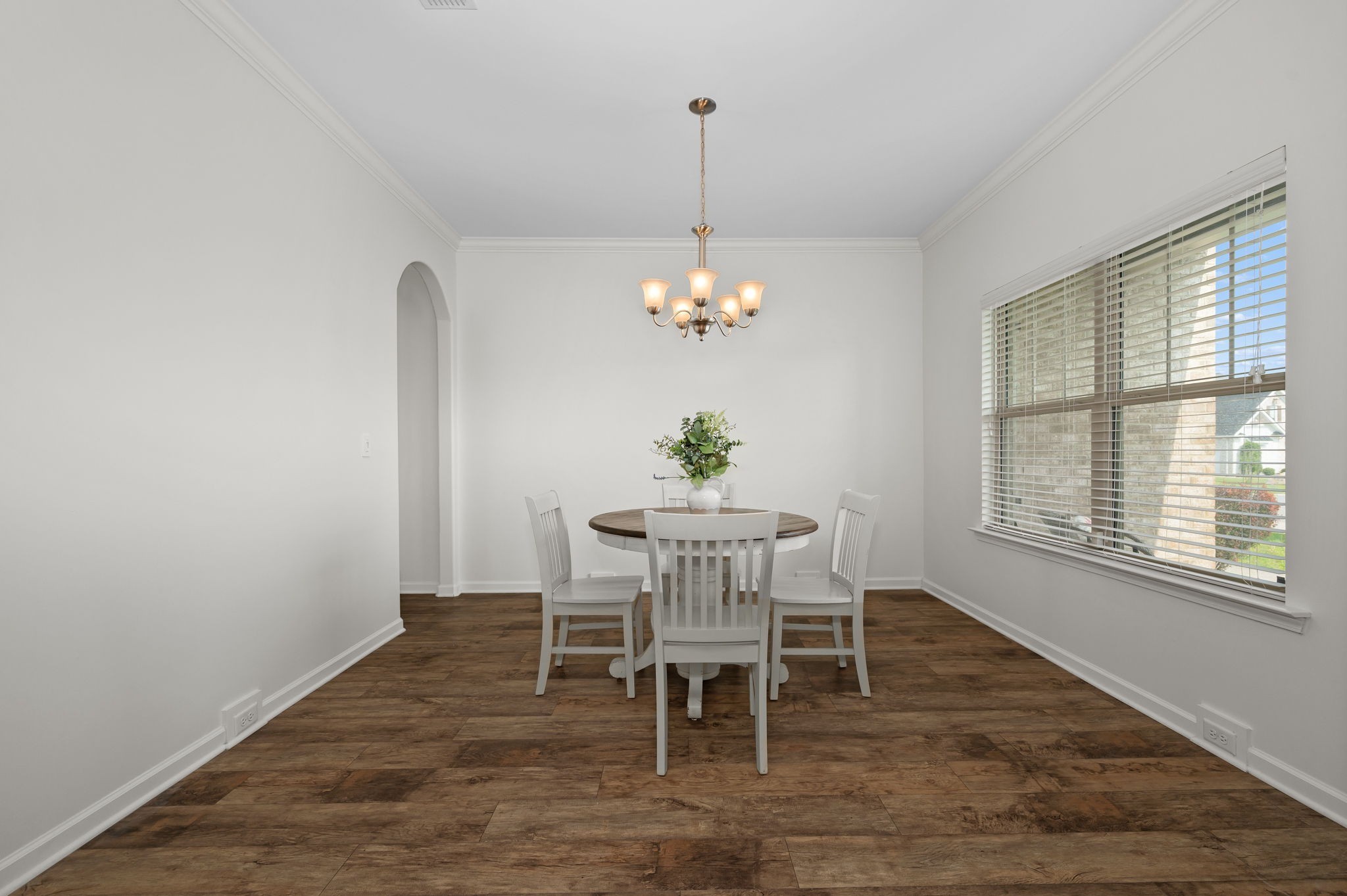 1113 Dunkirk Lane Murfreesboro, TN 37129 - Photo 4 of 31 a dining room with furniture a chandelier and wooden floor