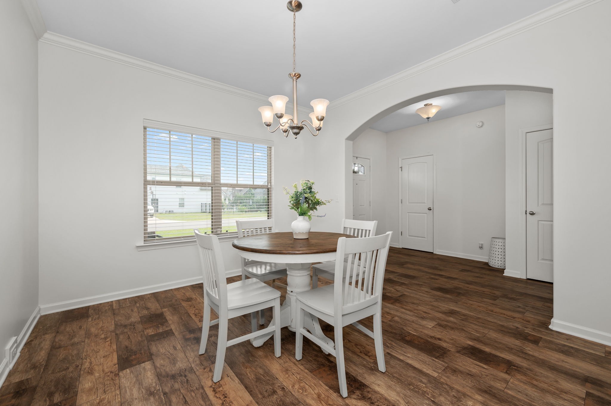 1113 Dunkirk Lane Murfreesboro, TN 37129 - Photo 6 of 31 a view of a dining room with furniture a chandelier and wooden floor