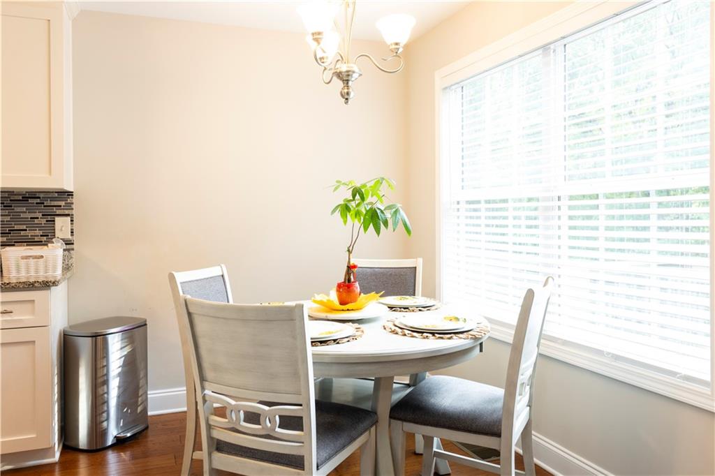 355 Conner Court Social Circle, GA 30025 - Photo 14 of 52 a dining room with furniture and wooden floor