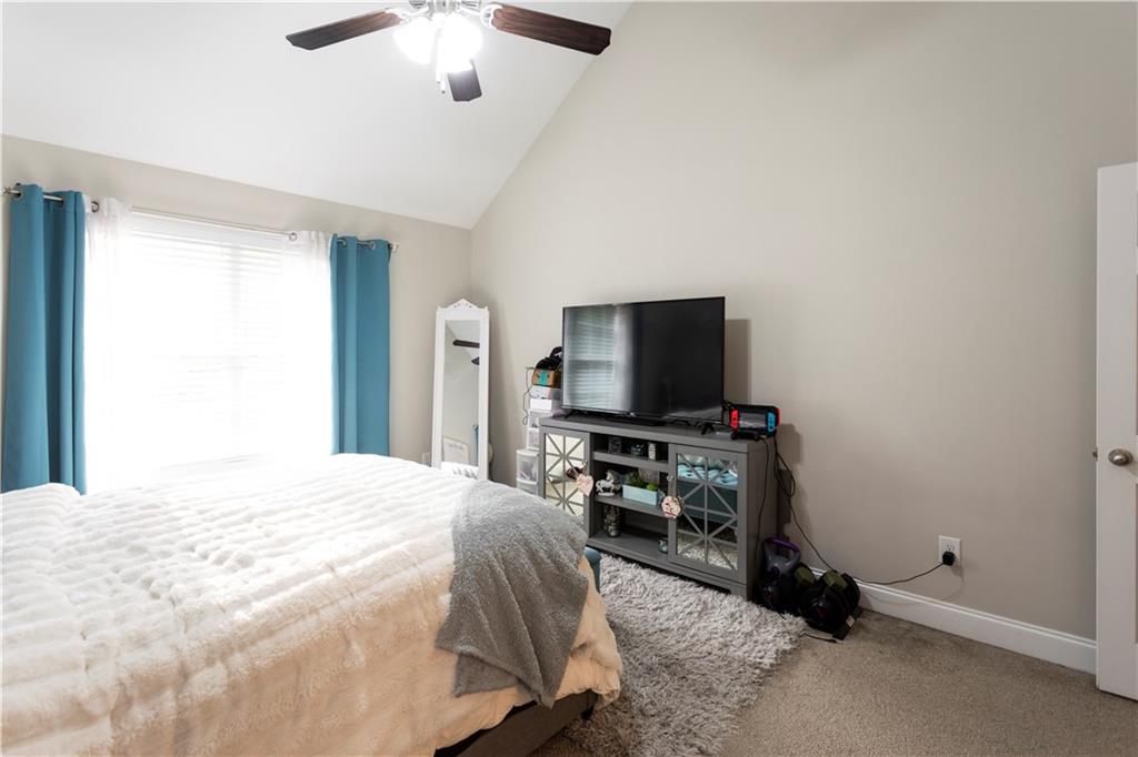 355 Conner Court Social Circle, GA 30025 - Photo 15 of 52 a bedroom with a bed and a flat screen tv