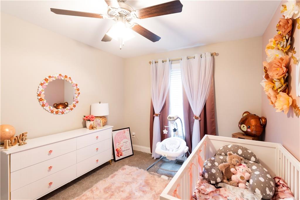 355 Conner Court Social Circle, GA 30025 - Photo 26 of 52 a bed room with a bed and a window