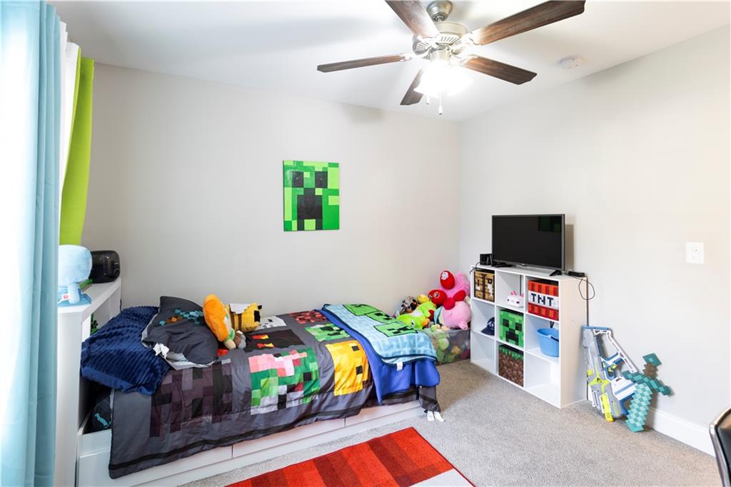355 Conner Court Social Circle, GA 30025 - Photo 30 of 52 a play room with toys and a tv