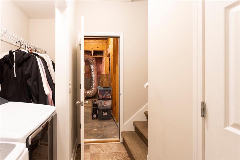 355 Conner Court Social Circle, GA 30025 - Photo 35 of 52 a view of walk in closet with clothes and shoes