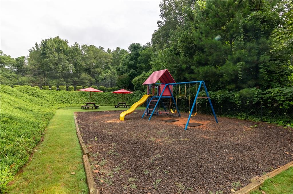355 Conner Court Social Circle, GA 30025 - Photo 49 of 52 a view of outdoor space with playground and green space