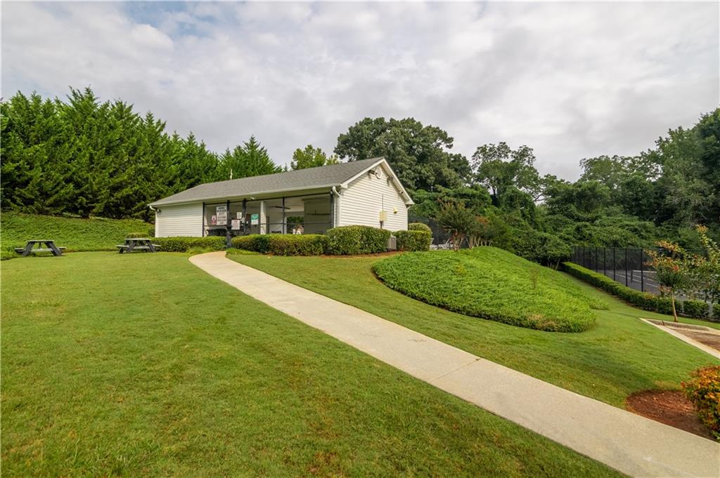 355 Conner Court Social Circle, GA 30025 - Photo 52 of 52 a view of a house with a big yard potted plants and large tree