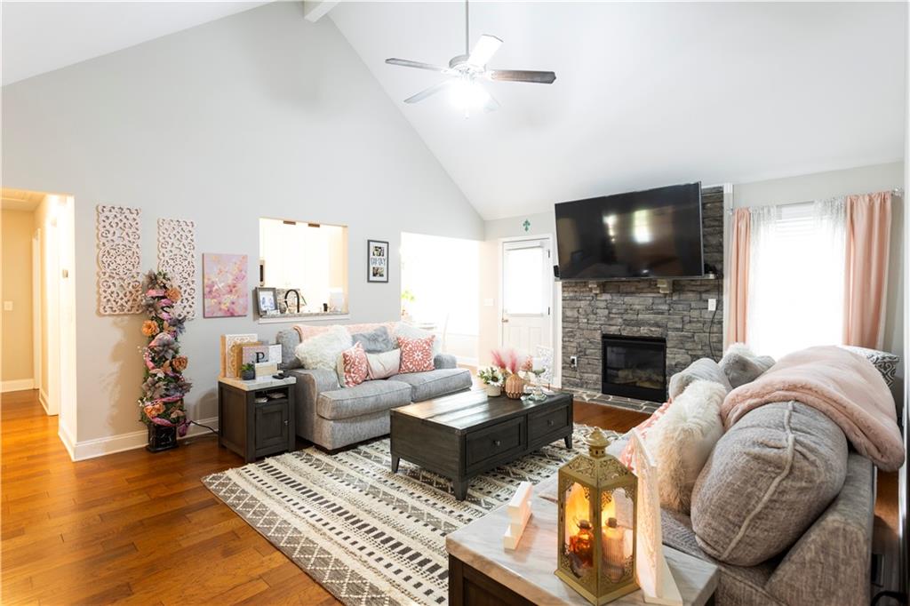 355 Conner Court Social Circle, GA 30025 - Photo 10 of 52 a living room with furniture a flat screen tv and a fireplace