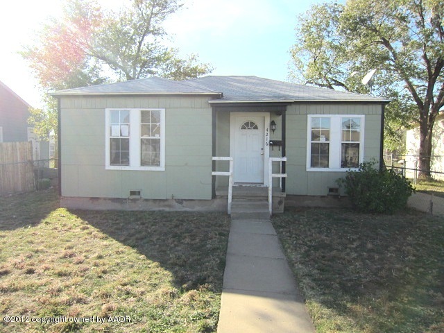 4216 South Harrison Street Amarillo, TX 79110 - Photo 1 of 14 a front view of a house with a porch