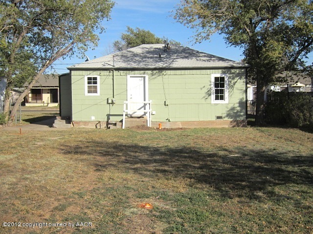 4216 South Harrison Street Amarillo, TX 79110 - Photo 7 of 14 a backyard of a house with yard fire pit and outdoor seating