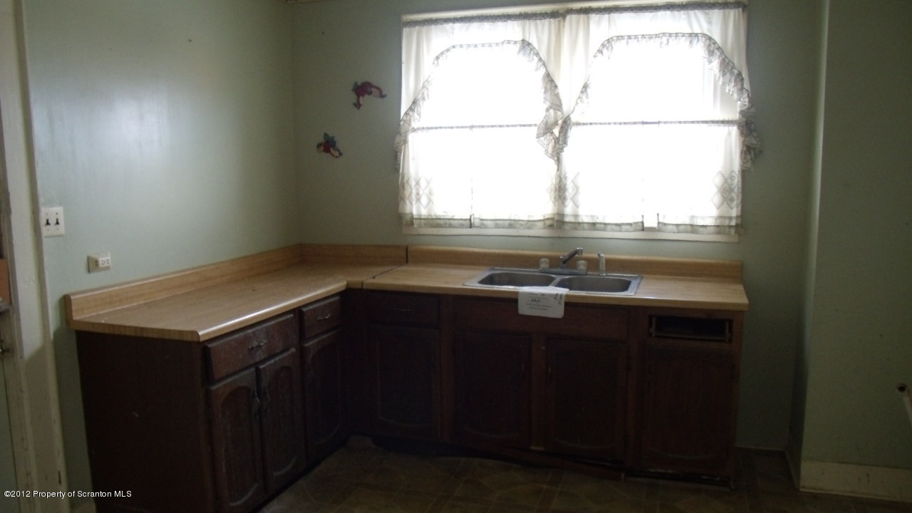 122 East Mountain Road Scranton, PA 18505 - Photo 12 of 12 a kitchen with a sink window and cabinets