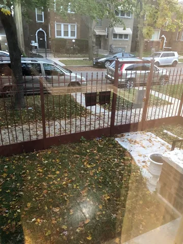 a view of a street with a building in the background