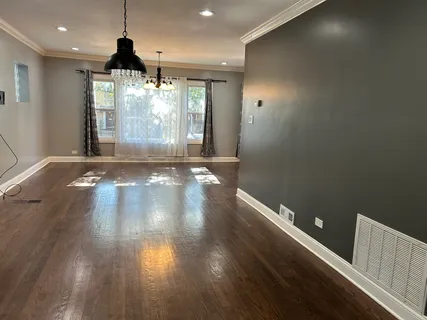 a view of gallery with wooden floor