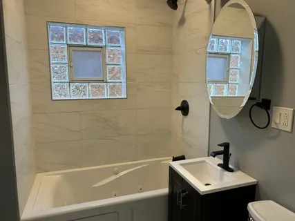 a bathroom with a sink and a mirror
